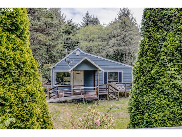 view of front of property with a wooden deck