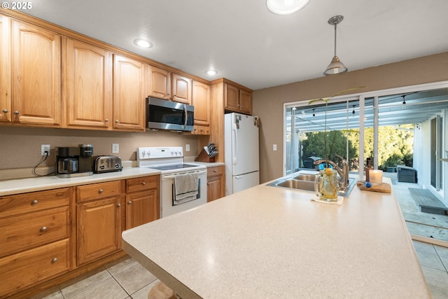 kitchen featuring light tile patterned flooring, sink, pendant lighting, and white appliances