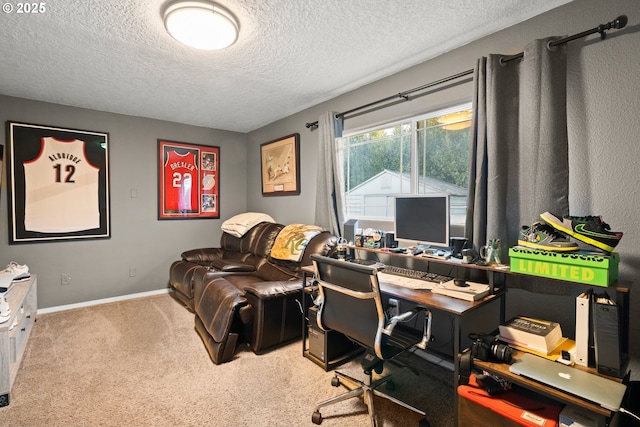 carpeted office with a textured ceiling