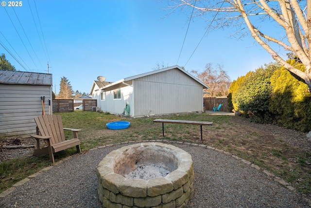 view of patio featuring an outdoor structure and an outdoor fire pit