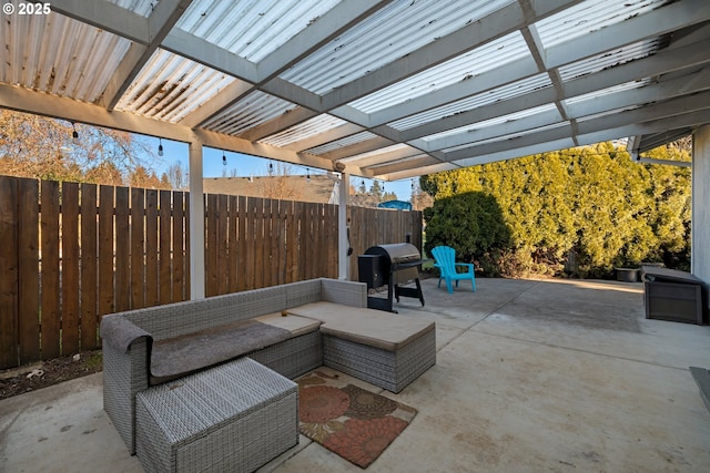 view of patio / terrace featuring area for grilling, an outdoor living space, and a pergola