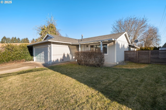 single story home featuring a garage and a front lawn