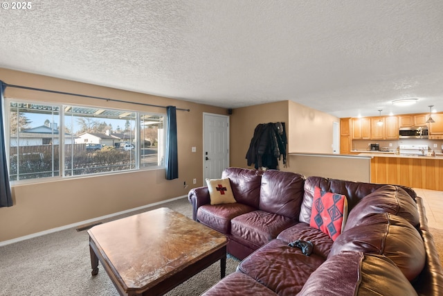 carpeted living room featuring a textured ceiling