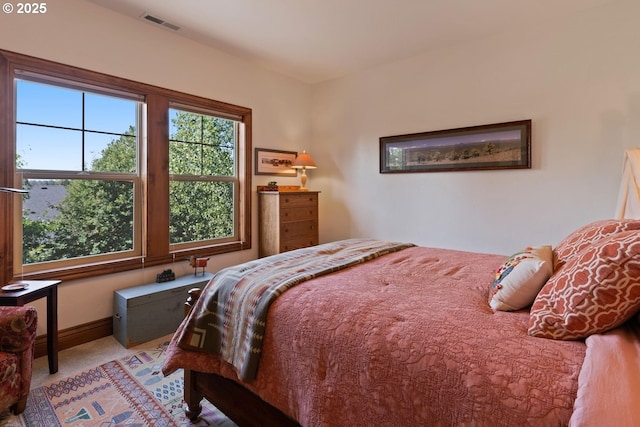 bedroom featuring visible vents