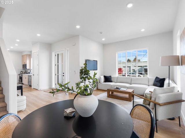 living room with light hardwood / wood-style floors