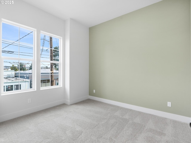 empty room with light colored carpet