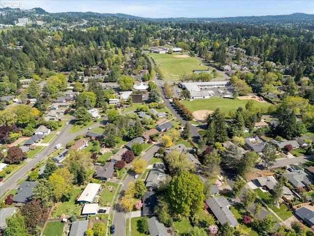 aerial view with a residential view and a wooded view