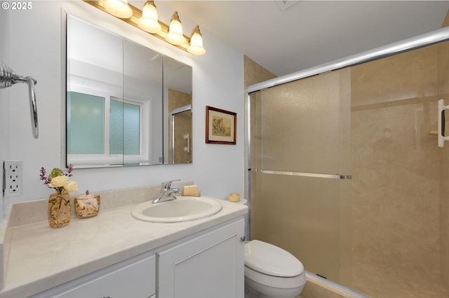 full bath with toilet, a shower stall, and vanity