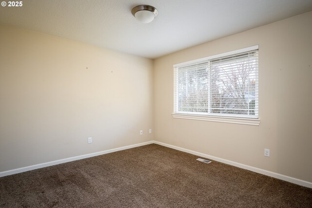 unfurnished room featuring carpet flooring