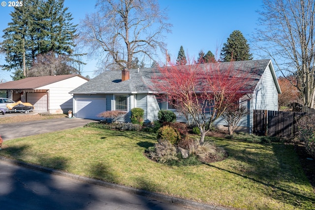 view of front of house with a garage and a front yard