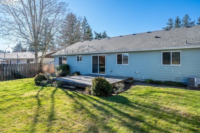 back of property with a yard, central AC, and a deck