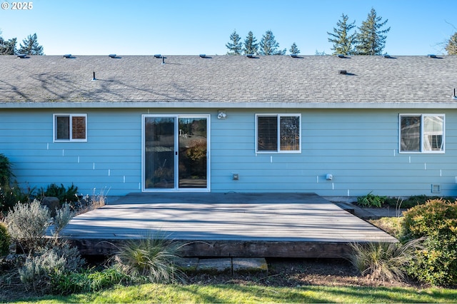 back of property featuring a wooden deck