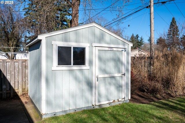 view of outbuilding with a yard