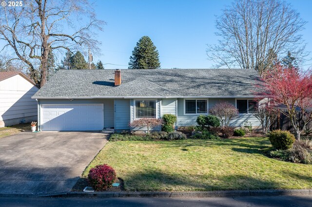 ranch-style home with a garage and a front lawn