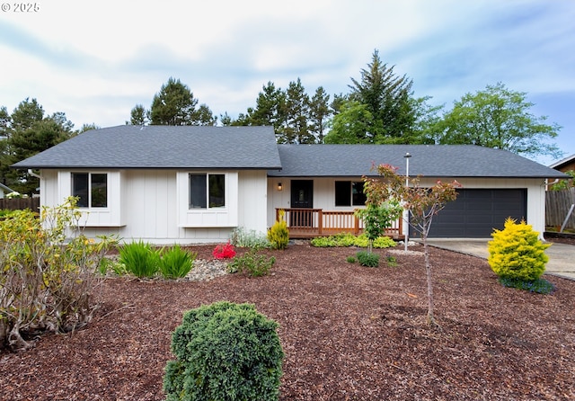4045 Spruce St, Florence, OR 97439 - view of front of property with driveway, a garage, a porch, and a shingled roof