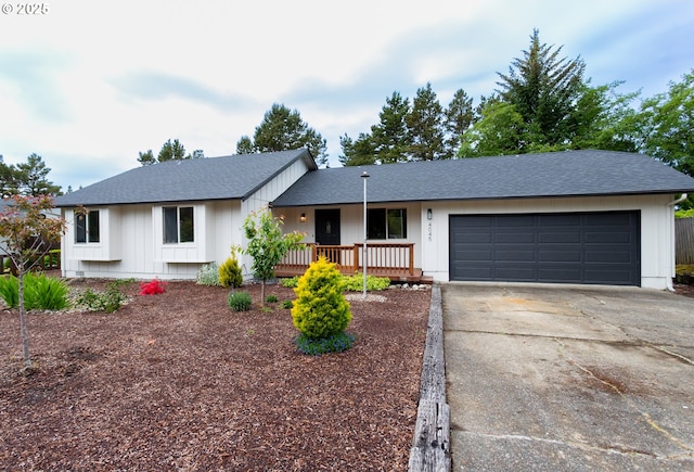 4045 Spruce St, Florence, OR 97439 - view of front of home featuring a garage, concrete driveway, and a shingled roof