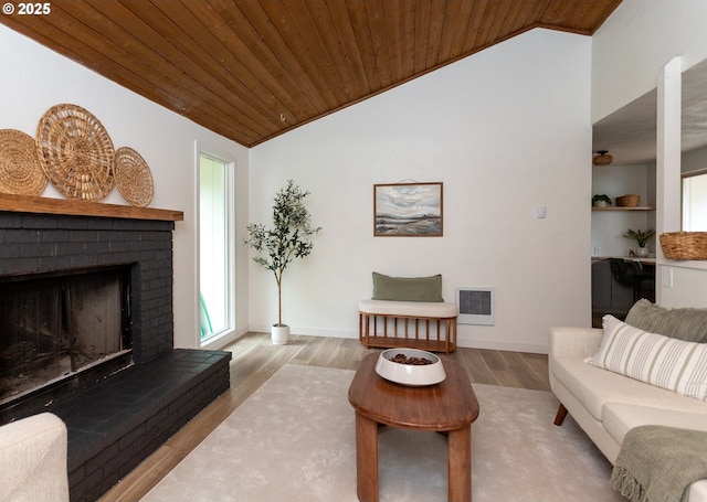 4045 Spruce St, Florence, OR 97439 - living area featuring wood ceiling, lofted ceiling, a fireplace, wood finished floors, and baseboards