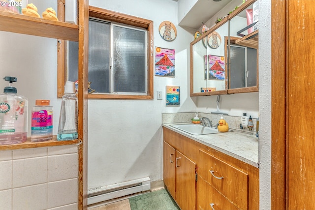 bathroom featuring vanity and a baseboard heating unit