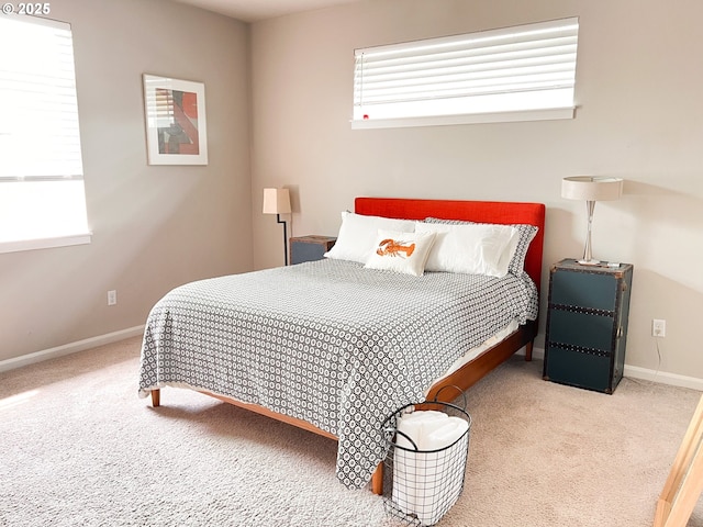 bedroom with baseboards and carpet floors