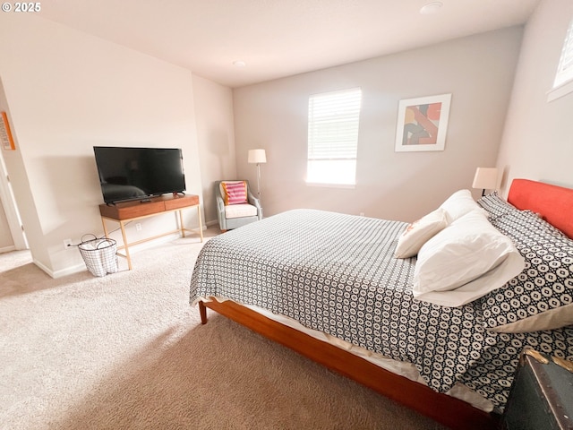 carpeted bedroom with baseboards