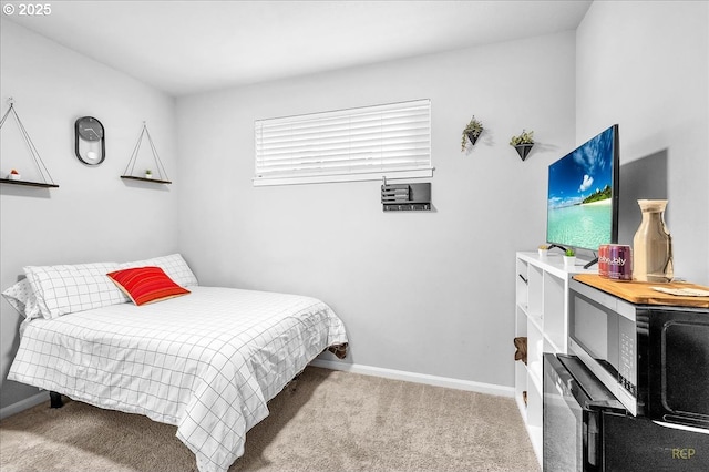 carpeted bedroom with baseboards