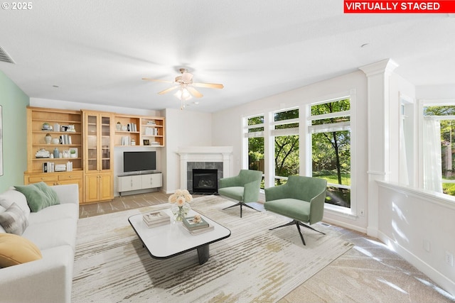 16273 Barlow Dr, Oregon City, OR 97045 - living room featuring a tile fireplace and a ceiling fan