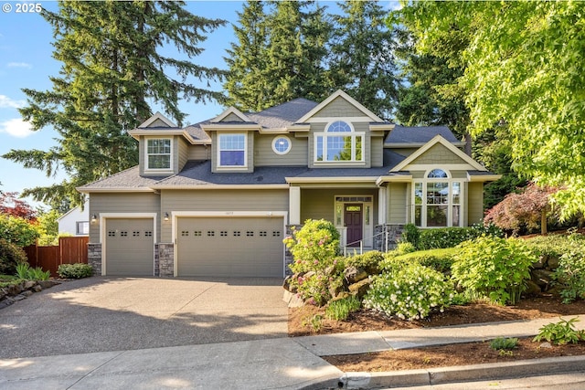 16273 Barlow Dr, Oregon City, OR 97045 - craftsman-style home featuring stone siding, driveway, a garage, and roof with shingles