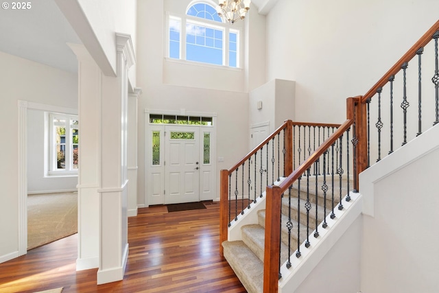 16273 Barlow Dr, Oregon City, OR 97045 - foyer entrance featuring a towering ceiling, healthy amount of natural light, wood finished floors, and stairs