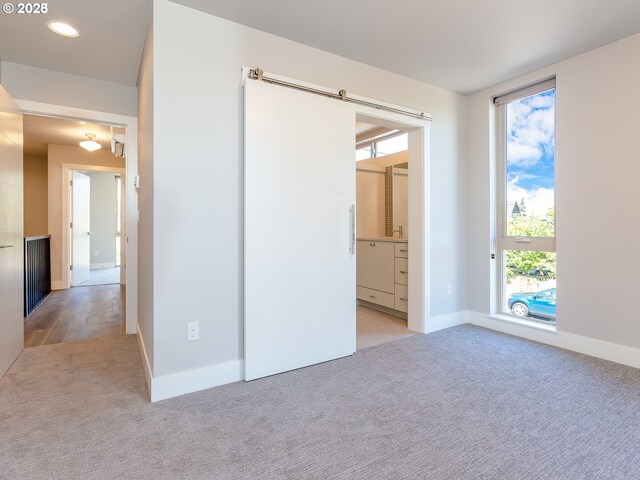 4984 NE 32nd Pl, Portland, OR 97211 - unfurnished bedroom with light carpet, baseboards, and recessed lighting
