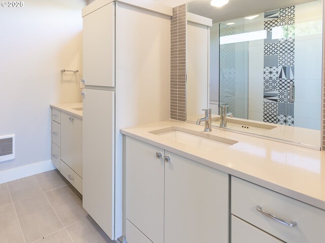 4984 NE 32nd Pl, Portland, OR 97211 - bathroom featuring vanity, tile patterned floors, a stall shower, and baseboards