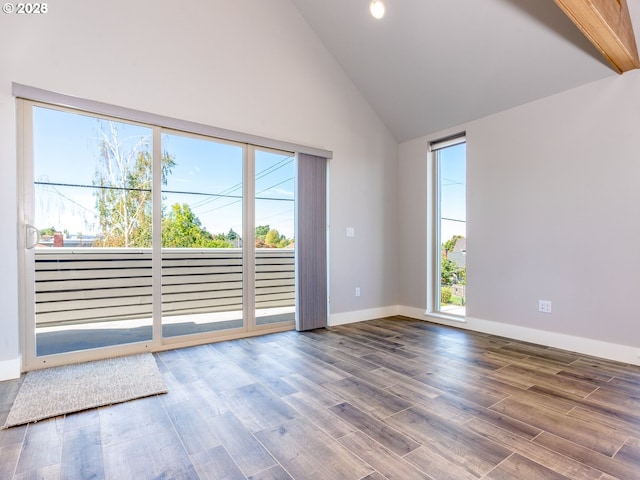 4984 NE 32nd Pl, Portland, OR 97211 - spare room featuring high vaulted ceiling, wood finished floors, and baseboards