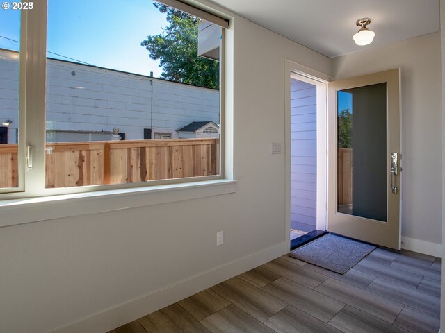 4984 NE 32nd Pl, Portland, OR 97211 - foyer entrance featuring baseboards and wood finished floors