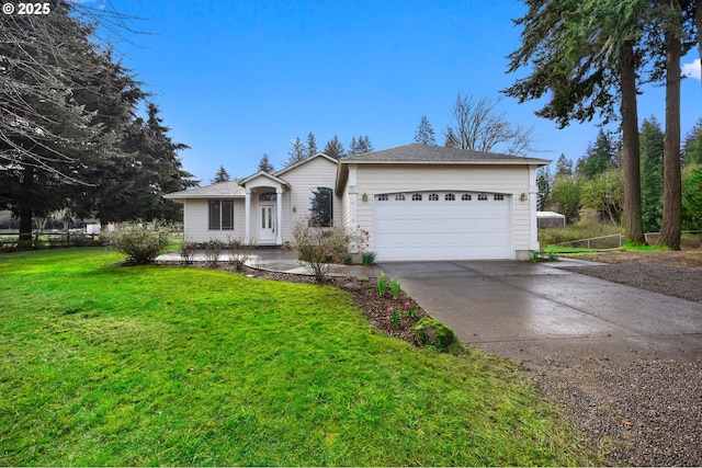 ranch-style home with a front yard, concrete driveway, and an attached garage