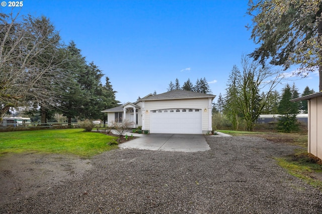 ranch-style house featuring a garage, concrete driveway, and a front yard