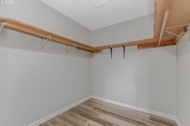 320 NE 117th Ave, Portland, OR 97220 - walk in closet featuring wood finished floors
