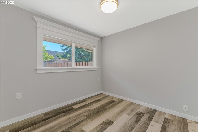 320 NE 117th Ave, Portland, OR 97220 - empty room featuring wood finished floors and baseboards