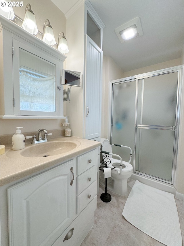 bathroom featuring tile patterned floors, a shower stall, toilet, and vanity