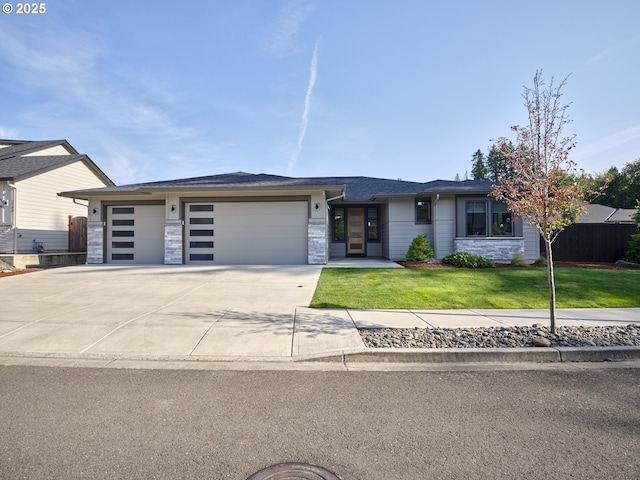 1703 SE 42nd Way, Brush Prairie, WA 98606 - view of front of house featuring a garage, concrete driveway, and stone siding