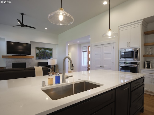 1703 SE 42nd Way, Brush Prairie, WA 98606 - kitchen with appliances with stainless steel finishes, open shelves, pendant lighting, a fireplace, and recessed lighting