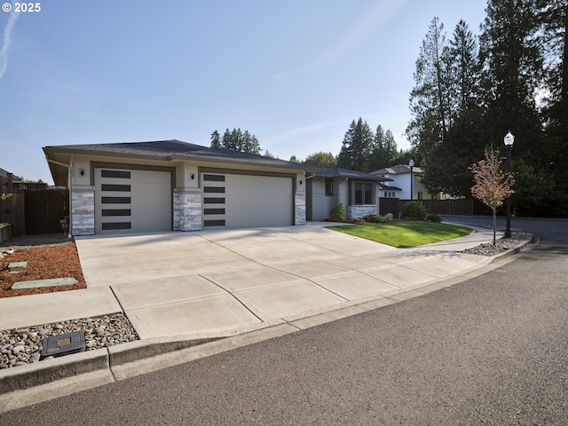 1703 SE 42nd Way, Brush Prairie, WA 98606 - view of front of property with an attached garage, driveway, and stone siding