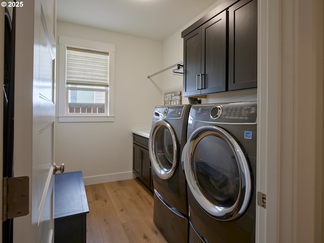 1703 SE 42nd Way, Brush Prairie, WA 98606 - laundry room with independent washer and dryer, cabinet space, and light wood-type flooring