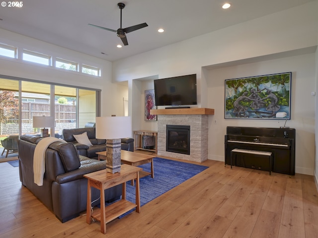 1703 SE 42nd Way, Brush Prairie, WA 98606 - living room with a ceiling fan, a stone fireplace, hardwood / wood-style flooring, and recessed lighting