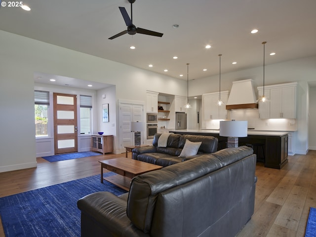 1703 SE 42nd Way, Brush Prairie, WA 98606 - living area featuring light wood-style floors, ceiling fan, and recessed lighting