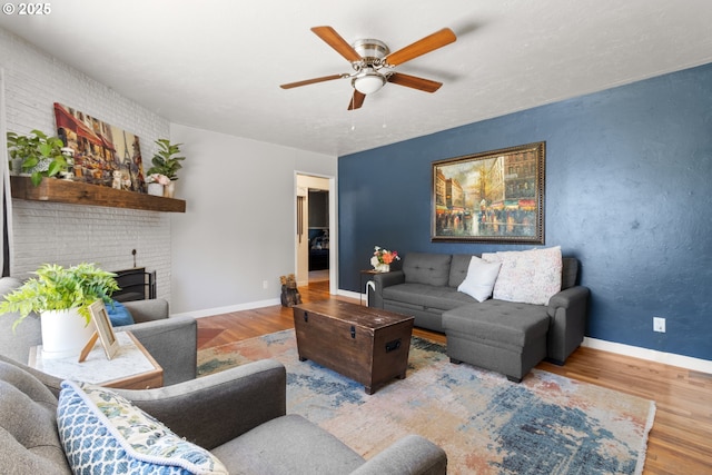 2408 N College St, Newberg, OR 97132 - living area with wood finished floors, a ceiling fan, and baseboards