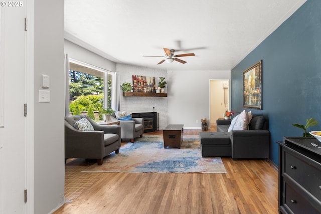2408 N College St, Newberg, OR 97132 - living area with a ceiling fan, light wood-style flooring, and a fireplace