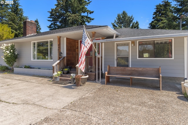 2408 N College St, Newberg, OR 97132 - view of front of house with a chimney and roof with shingles
