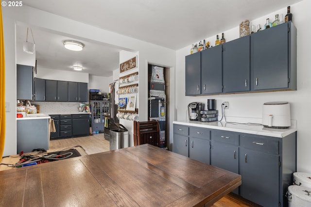 2408 N College St, Newberg, OR 97132 - kitchen featuring light countertops, tasteful backsplash, and light wood-style floors