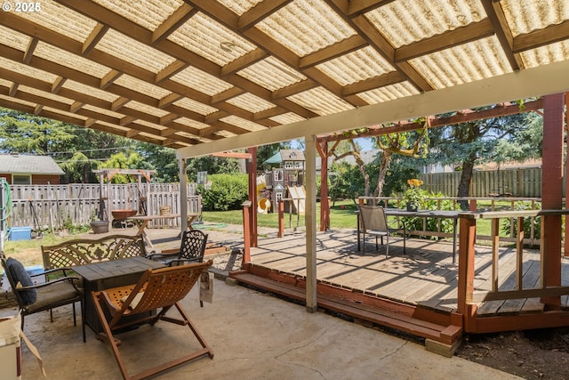 2408 N College St, Newberg, OR 97132 - fenced backyard with outdoor dining area, a playground, a wooden deck, and a patio