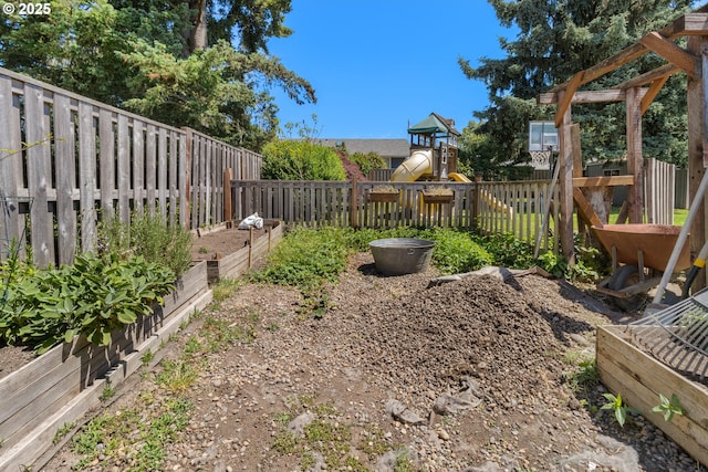 2408 N College St, Newberg, OR 97132 - fenced backyard with a playground and a garden