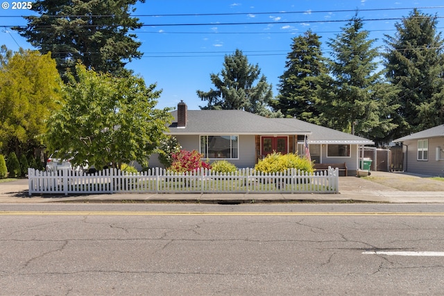 2408 N College St, Newberg, OR 97132 - view of front facade featuring a chimney and a fenced front yard